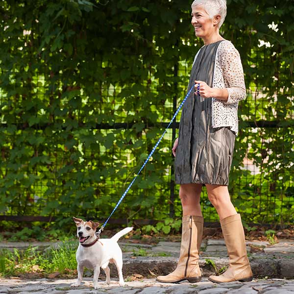 Exactech Ankle Replacement Woman walking dog