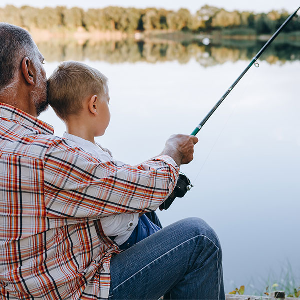 Man fishing with child